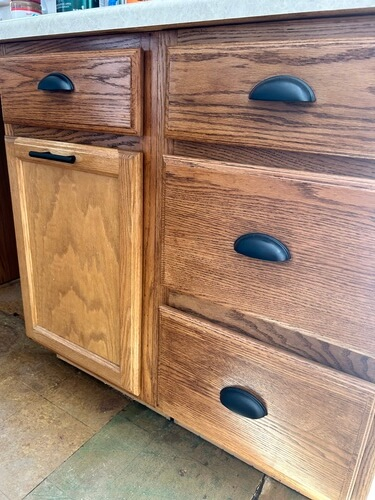 updated oak cabinets Briwax Tudor Brown matte black hardware kitchen makeover